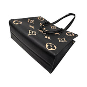 Louis Vuitton - Bicolor Giant Monogram Empreinte OnTheGo MM